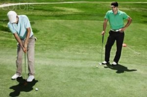 Two men playing golf